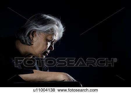 Stock Photo - Old woman feeling depressed. Fotosearch