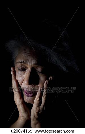 Stock Photography - Old woman feeling depressed. Fotosearch