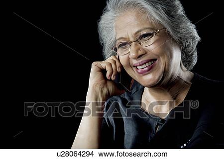 Picture - Old woman with glasses smiling. Fotosearch