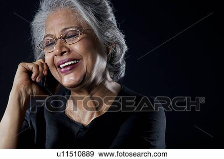 Stock Photo - Old woman with glasses smiling. Fotosearch