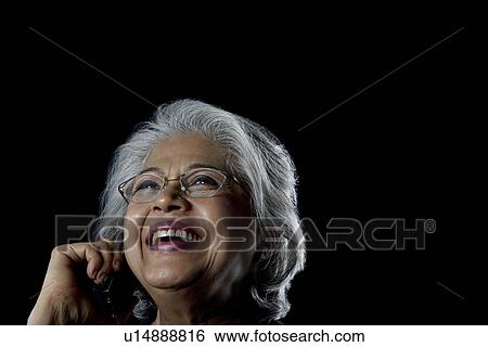 Stock Photograph - Old woman with glasses smiling. Fotosearch