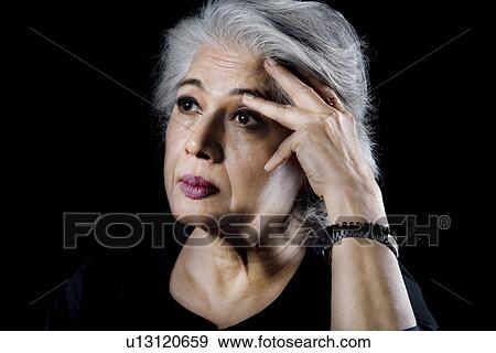 Stock Photo - Old woman worried. Fotosearch