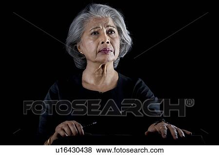 Stock Photo - Old woman worried. Fotosearch