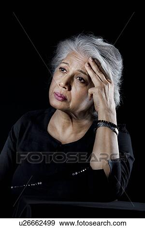 Stock Photo - Old woman worried. Fotosearch