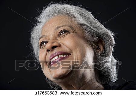 Stock Image - Portrait of an old woman smiling. Fotosearch