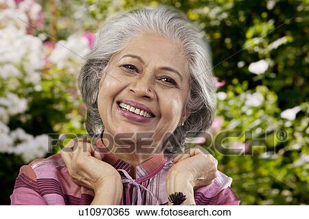Stock Photography - Portrait of an old woman smiling. Fotosearch