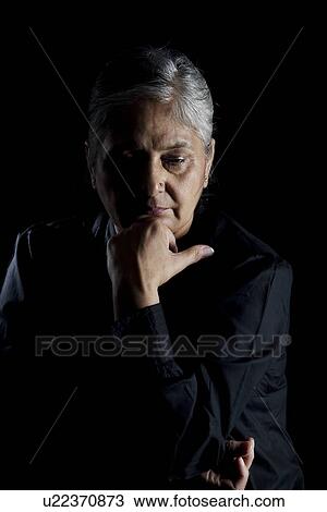 Stock Image - Portrait of an old woman. Fotosearch