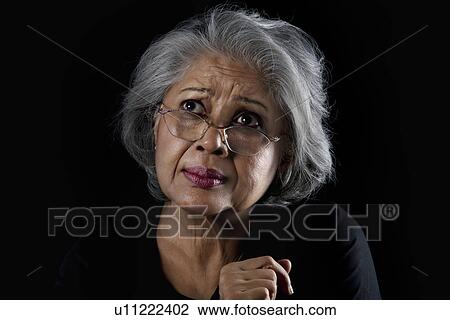 Portrait of an old woman with eye glasses View Large Photo Image Stock Image - Portrait of an old woman with eye glasses. Fotosearch