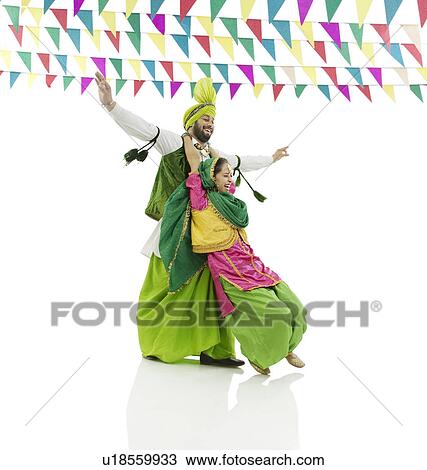 Stock Image - Sikh couple enjoying themselves. Fotosearch