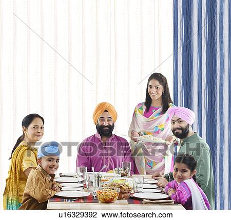 Sikh family at the dinner table View Large Photo Image Stock Image - Sikh family at the dinner table. Fotosearch