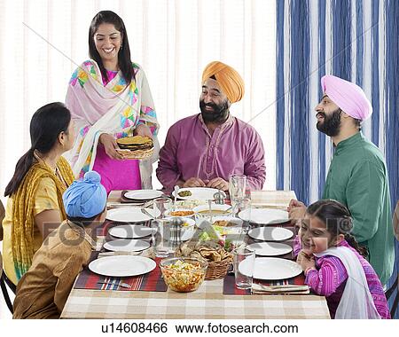 Sikh family having lunch View Large Photo Image Stock Photograph - Sikh family having lunch. Fotosearch