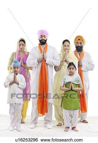 Stock Photograph - Sikh family praying. Fotosearch