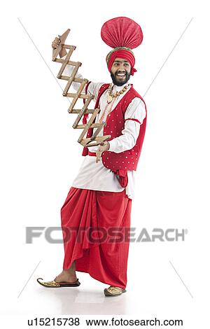 Sikh man holding a supp View Large Photo Image Stock Photo - Sikh man holding a supp. Fotosearch