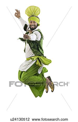 Stock Image - Sikh man jumping in the air. Fotosearch