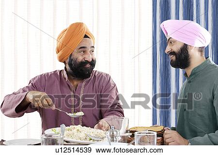 Stock Photo - Sikh men having lunch. Fotosearch
