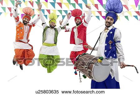 Stock Photography - Sikh men jumping in the air. Fotosearch