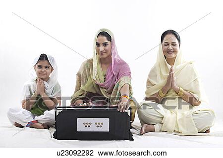Sikh woman playing the harmonium View Large Photo Image Stock Image - Sikh woman playing the harmonium. Fotosearch