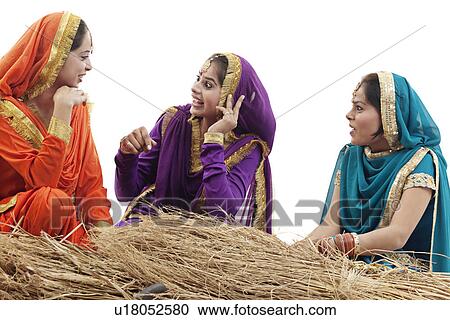 Stock Image - Sikh women talking to each other. Fotosearch