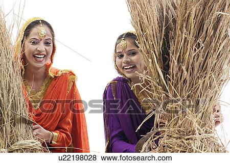 Sikh women with sickles and hay bales View Large Photo Image Stock Photo - Sikh women with sickles and hay bales. Fotosearch