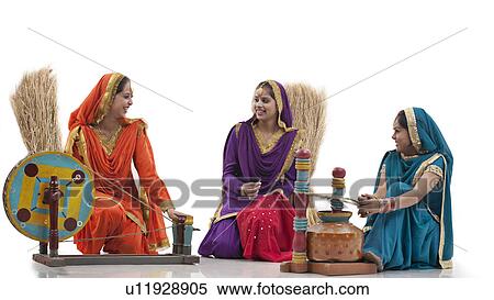 Women with a spinning wheel and a butter churner View Large Photo Image Stock Photography - Women with a spinning wheel and a butter churner. Fotosearch