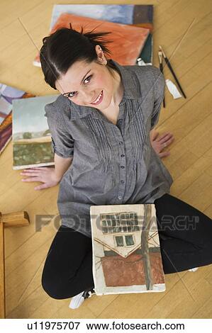 Stock Photo - Artist and canvass painting. Fotosearch