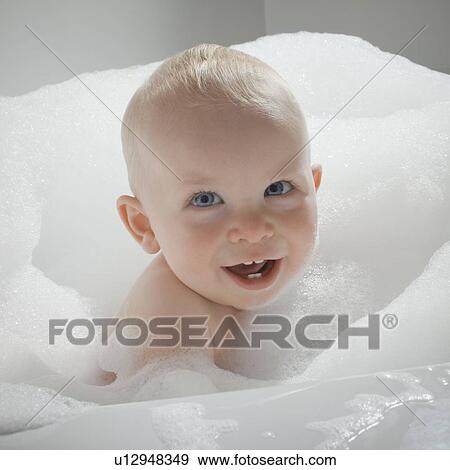 Baby in bathtub View Large Photo Image Stock Photo - Baby in bathtub. Fotosearch