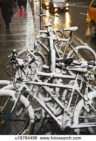 Bicycles covered in snow View Large Photo Image Stock Photo - Bicycles covered in snow. Fotosearch