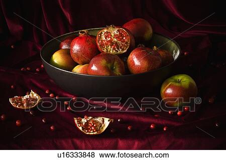 Bowl of pomegranates and apples View Large Photo Image Stock Photo - Bowl of pomegranates and apples. Fotosearch