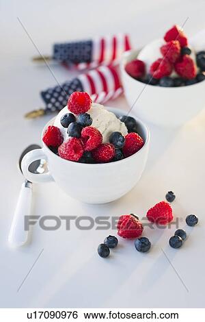 Stock Photograph - Bowls of ice cream and fruit. Fotosearch