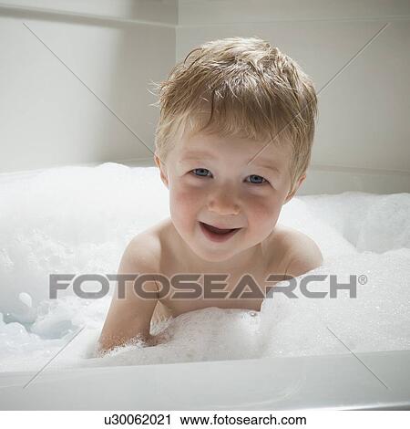 Boy in bubble bath View Large Photo Image Stock Image - Boy in bubble bath. Fotosearch