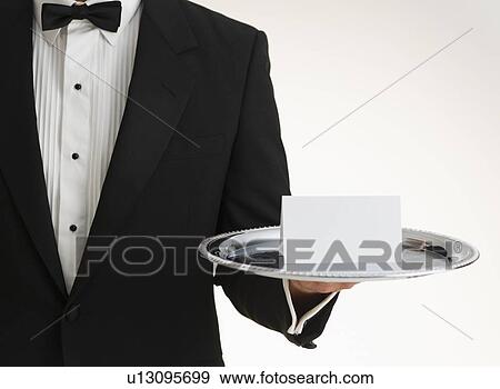 Stock Photo - Butler holding silver tray. Fotosearch