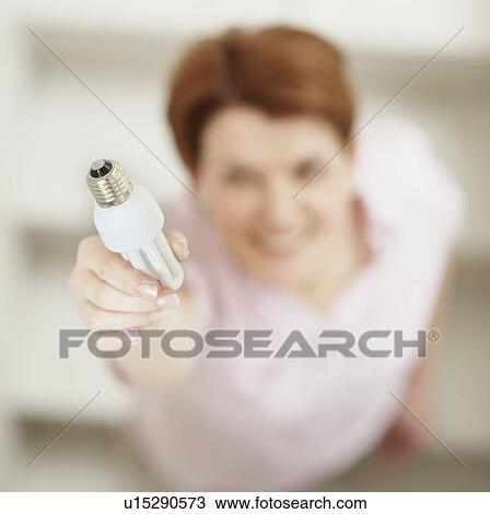 Changing a light bulb View Large Photo Image Stock Image - Changing a light bulb. Fotosearch