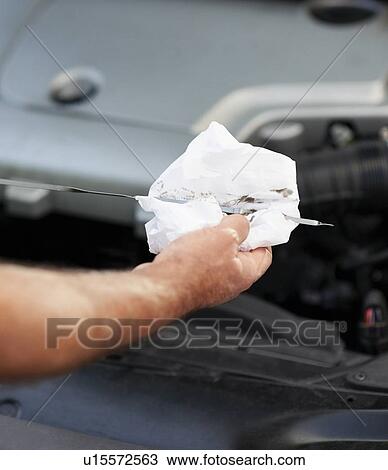 Stock Image - Checking the oil. Fotosearch