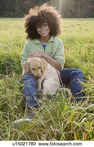 Stock Image - Child and dog. Fotosearch