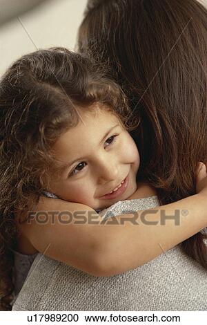 Child embracing mother View Large Photo Image Stock Image - Child embracing mother. Fotosearch