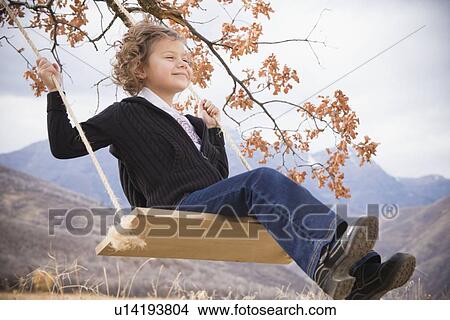 Picture - Child on swing. Fotosearch
