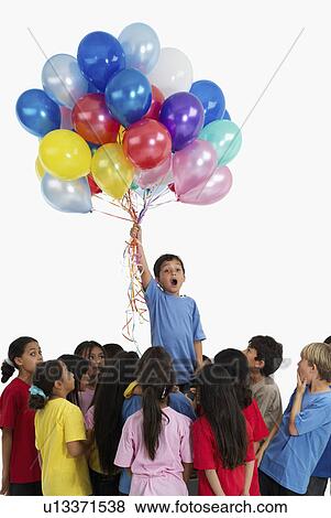 Children and balloons View Large Photo Image Stock Photo - Children and balloons. Fotosearch