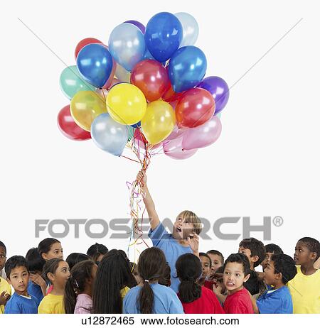 Stock Photography - Children and balloons. Fotosearch
