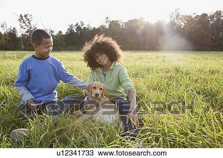 Stock Image - Children and dog. Fotosearch