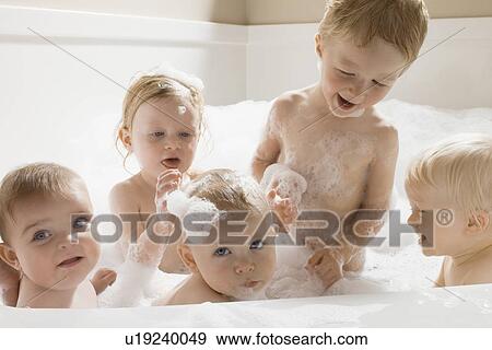 Children having a bath together View Large Photo Image Stock Photo - Children having a bath together. Fotosearch