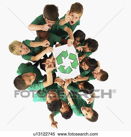 Stock Photography - Children holding recycle sign. Fotosearch
