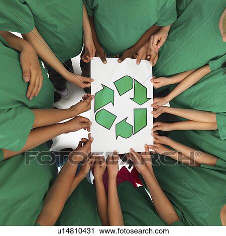 Stock Image - Children holding recycling sign. Fotosearch