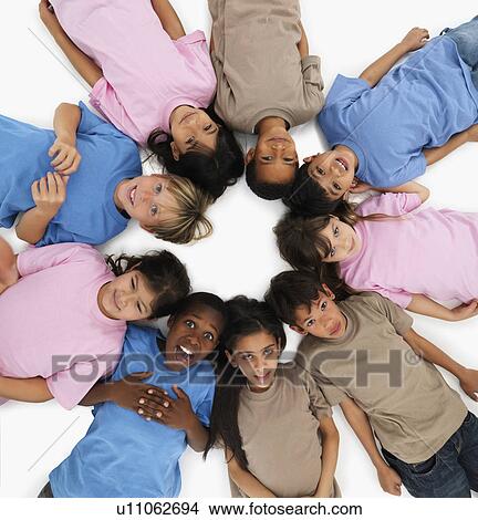 Picture - Children lying in a circle. Fotosearch