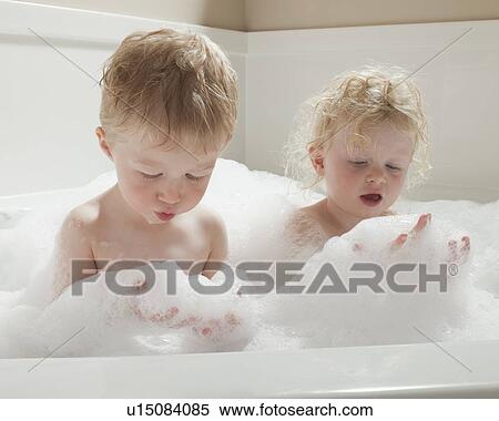 Children playing with bubbles in the bath tub View Large Photo Image Stock Photography - Children playing with bubbles in the bath tub. Fotosearch