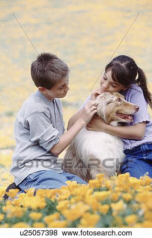 Children with dog in meadow View Large Photo Image Stock Photo - Children with dog in meadow. Fotosearch