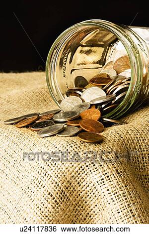 Coins in a jar View Large Photo Image Stock Photograph - Coins in a jar. Fotosearch