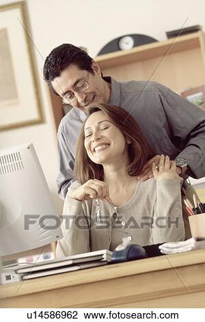 Stock Image - Couple in home office. Fotosearch