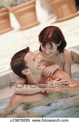 Couple in pool View Large Photo Image Stock Photography - Couple in pool. Fotosearch