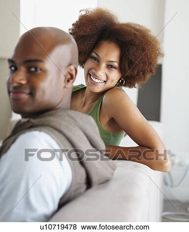 Couple on couch View Large Photo Image Stock Photo - Couple on couch. Fotosearch