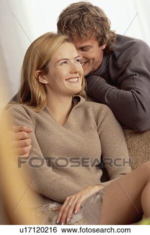 Stock Photograph - Couple relaxing at home. Fotosearch